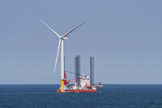 Wind turbine off the Norfolk Coast being constructed by a jack-up vessel