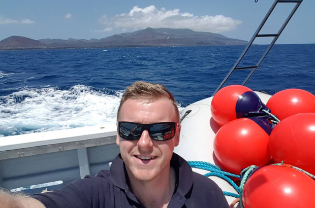 Dan on board a boat in the sea around St Helena.