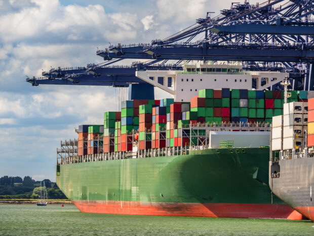 Large boat carrying shipping containers.