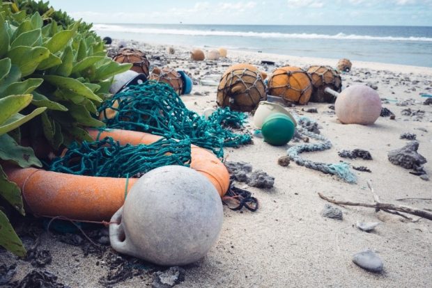 Washed up nets and letter on beach